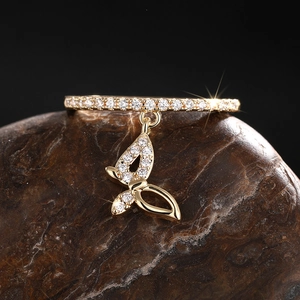 Exquisite 18K gold butterfly pendant ring with sparkling cubic zirconia on dark stone