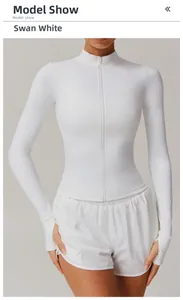 Detail of Swan White zip-up sports top with stand collar and functional thumbholes
