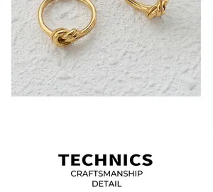 Macro shot of 18k gold plated knot ring with a polished mirror finish on white texture