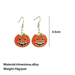 Detail view of pumpkin earrings featuring orange rhinestones and 4.5cm length dimensions