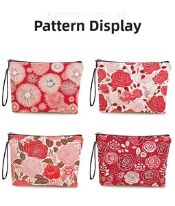 Detailed pattern display of floral toiletry bags with zipper and black carry strap