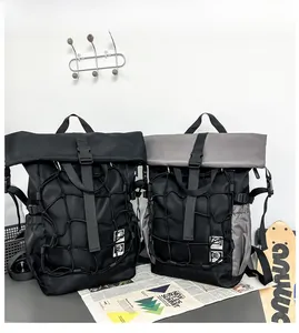 Detail of roll-top sports backpacks with elastic mesh pocket and helmet logo