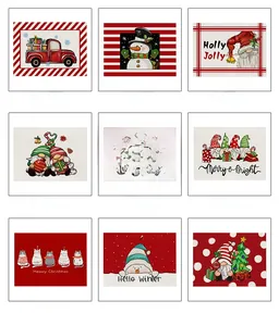 Close-up of Christmas linen placemats with gnome and festive patterns for table decor