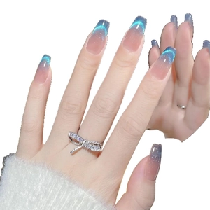 Bow tie silver ring with rectangular zircons on gradient blue cat eye coffin nails