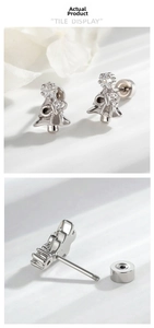 Detailed macro view of silver Christmas tree stud earrings with star zircon and screw back