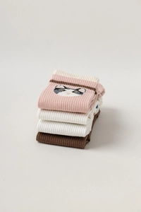 Folded yoga toe socks in pink, beige, white and brown with cute cat face patterns