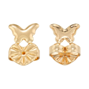 Macro detail of golden butterfly earring backs with secure anti-sag support design