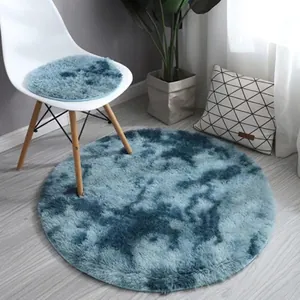 Detailed view of the thick blue gradient faux fur texture on the round plush area rug