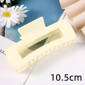 Detail shot of a 10.5cm matte beige rectangular hair claw clip with hollow design