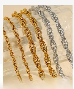 Detailed close-up of thick gold and steel rope chains with twisted texture and metallic shine