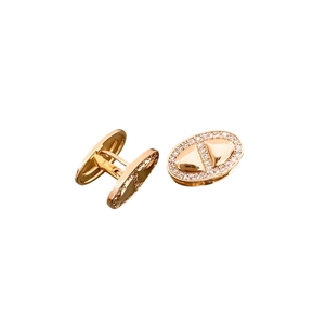 Rose gold pig nose cufflink with pavé cubic zirconia on minimalist white background