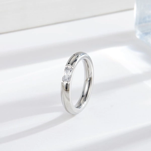 Minimalist silver steel ring with rectangle zircon on white geometric pedestal