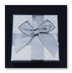 Elegant silver-gray gift box with diamond texture and satin ribbon for jewelry storage