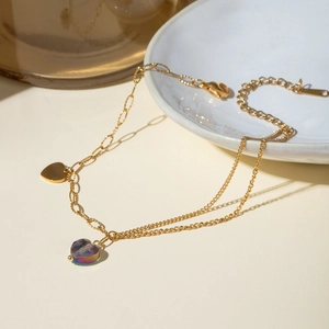 Detail of 16k gold double-layer butterfly anklet with colorful crystal heart charm