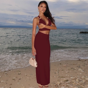 Detail of burgundy backless halter crop top and maxi skirt set for beach vacation
