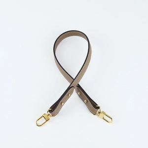 Close-up of elephant grey lychee grain leather shoulder strap with gold metal hooks
