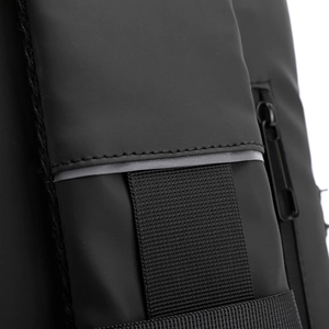 Macro shot of waterproof black fabric with reinforced nylon webbing and stitching details