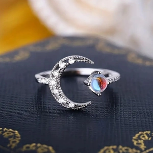 Exquisite silver crescent moon ring with shimmering moonstone and cubic zirconia stones