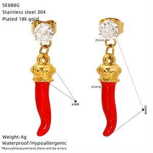 Detail of red cherry earrings in 18k gold plated steel with zircon and size markings