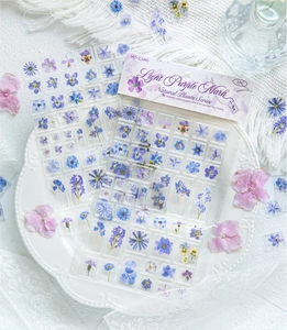 Detailed view of 3D acrylic floral stickers with purple dried flowers on a white tray