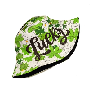 Detail of St. Patrick's Day bucket hat featuring green shamrocks and Lucky text