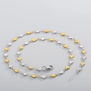 Detail of interlocking gold and silver heart-shaped links with durable lobster clasp