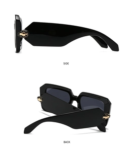 Detailed side and back view of black baroque sunglasses with golden honeycomb pattern temples