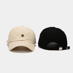 Front and back views of minimalist baseball caps with N letter embroidery and metal buckle