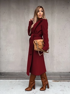Detail view of wine red wool blend long coat with matching waist belt and lapel