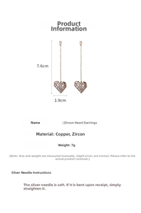 Dettaglio orecchini lunghi a cuore con dimensioni 7,6cm per 1,9cm e peso di 7g