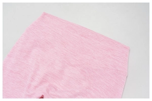 Close-up of pink heathered yoga pants showing high waist elastic and V-stitch seam