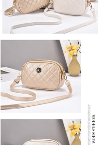Detail of quilted leather crossbody camera bag featuring a stylish 3D camellia flower logo