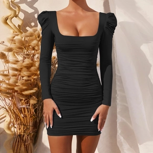 Close-up of black bodycon dress featuring elegant square neck and ruched fabric detail
