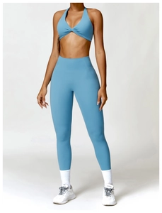 Light blue two-piece yoga set featuring a halter twist sports bra and high waist leggings