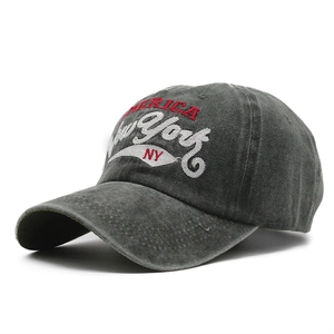 Detail of vintage washed dark gray cotton baseball cap with New York embroidery