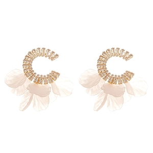 Elegant gold C-shaped earrings with clear crystals and translucent white flower petals