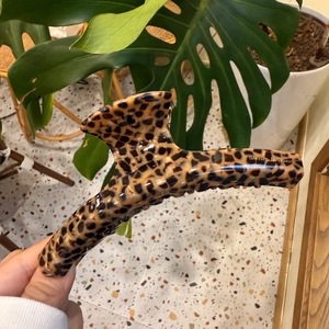 Close-up of leopard print hair claw with Barrette La France logo and glossy finish
