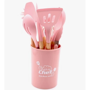 Detailed view of 12-piece pink silicone kitchen utensils with wooden handles in a bucket