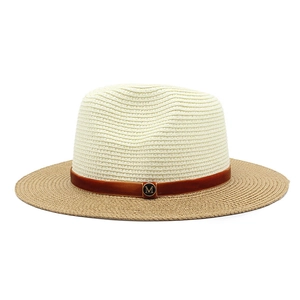 Close-up of bicolor straw fedora with brown velvet band and golden M metal buckle