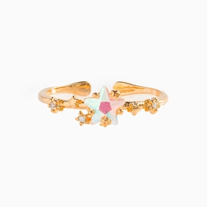 Detail of 18K gold star ring with iridescent opal star stone and small crystals