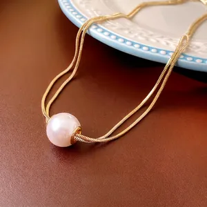 French vintage double-layered gold snake chain necklace with a large round white pearl