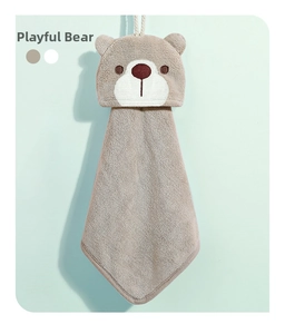 Macro detail of khaki bear hanging hand towel in soft coral fleece for kids
