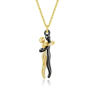 Detail shot of the couple hugging pendant in gold and black finish on metal chain