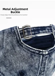 Detail of metal adjustment buckle on washed denim baseball cap for a custom fit