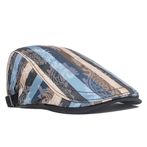 Close-up of retro striped beret with colorful jacquard texture and black brim details