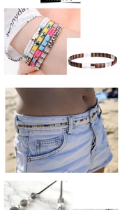 Macro detail of bohemian TILA bead jewelry set featuring colorful bracelets and waist chains