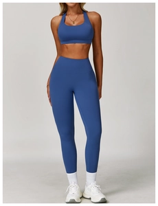 Detail of high-waist seamless compression yoga pants in dark blue quick-dry fabric
