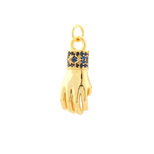 Detail of 18k gold plated evil eye hand pendant with blue zircon micro-pave setting