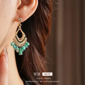 Bohemian gold chandelier earrings with green teardrop beads and zircon accents