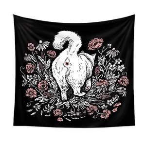Close-up of decorative black cat tapestry with intricate floral details and stitched edges